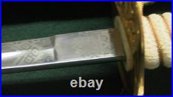 U. S. Navy Officer's Dress Sword in Scabbard with Engraved Blade with belt