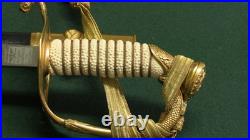 U. S. Navy Officer's Dress Sword in Scabbard with Engraved Blade with belt